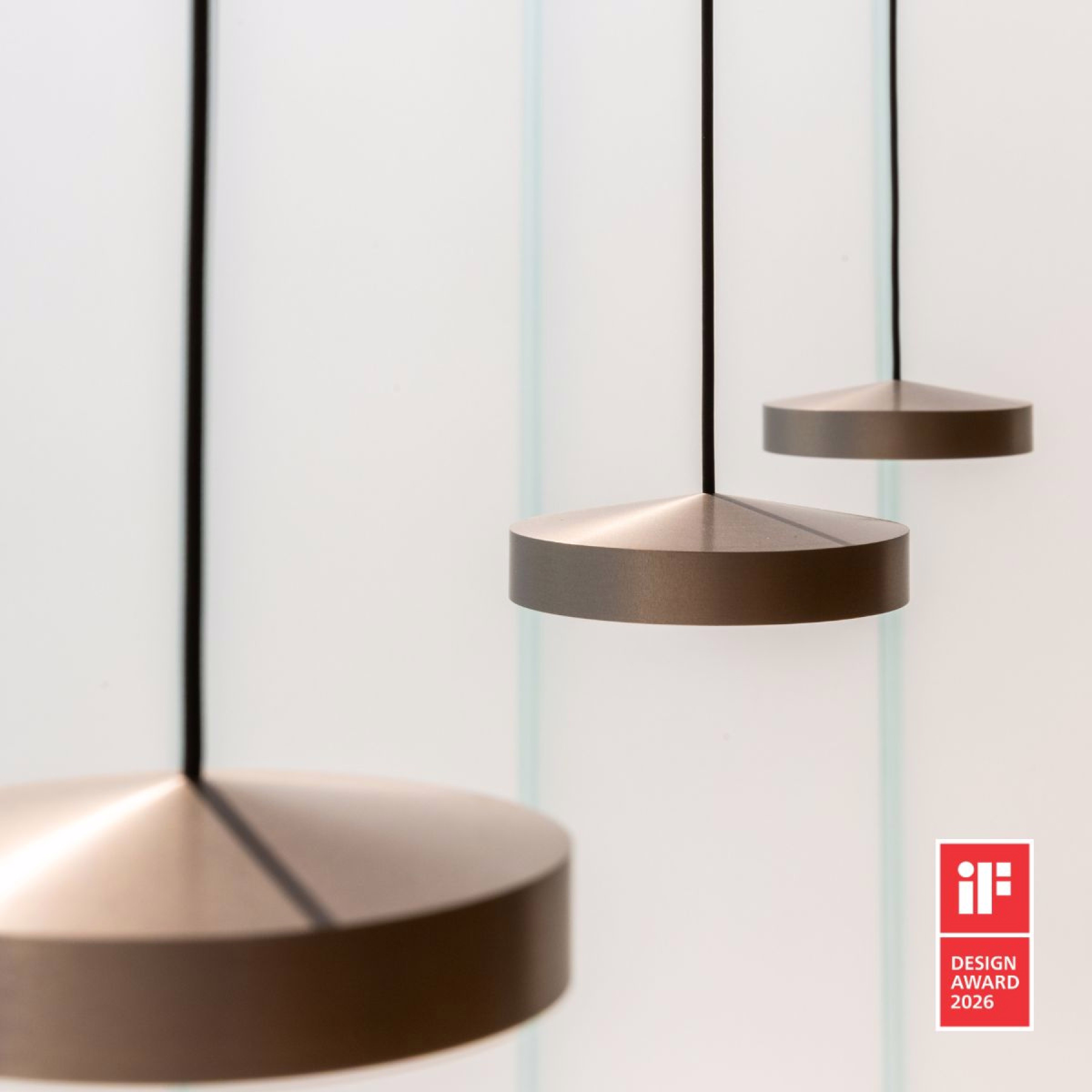 The award-winning DGA Luna pendant suspended in a modern environment
